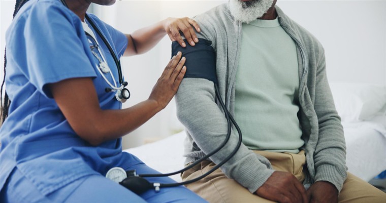 Nurse taking a patient's blood pressure